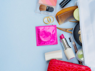 Women bag with, cosmetics medicine phone and markup set and condom save sex concept