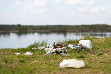 Garbage dump on the lake - environment pollution.