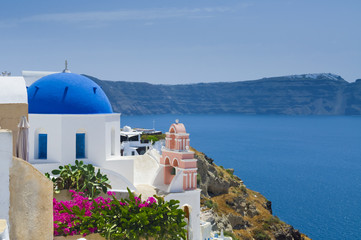 Picturesque image of Oia village blue dome on Santorini island