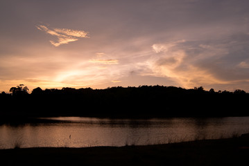 Beautiful sky landscape with sunset over river bank