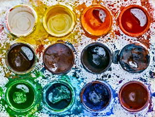 Used palette of children's watercolor paint, top view