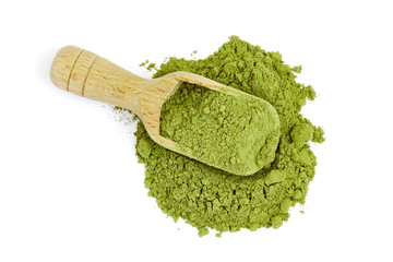 Moringa oleifera powder with wooden scoop isolated on white background. Top view
