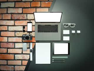 Office supplies with attributes and furniture for office on grey and brick background. 3D illustration.