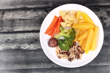 Fried potato and Shimeji mushroom with mixed vegetables.