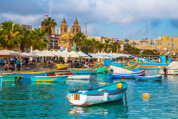 Marsaxlokk, Malta - Traditional colorful maltese Luzzu fisherboat at the old village of Marsaxlokk...