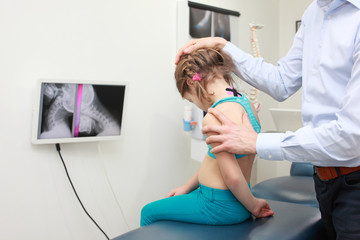kid's neck diagnosis and manual treatment in office
