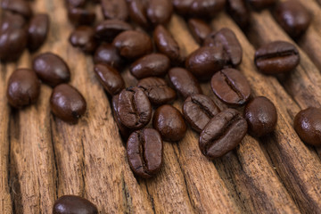 Roasted coffee bean on wood background