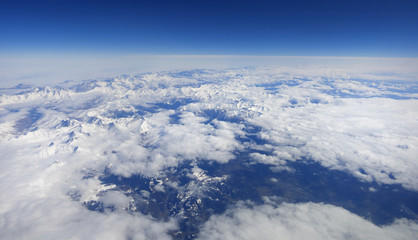 Naklejka na ściany i meble Panorama of white mountains with clouds