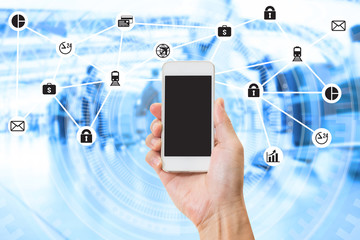 Hand holding mobile phone over double exposure of blurred people travel and data management system internet of things graphics design