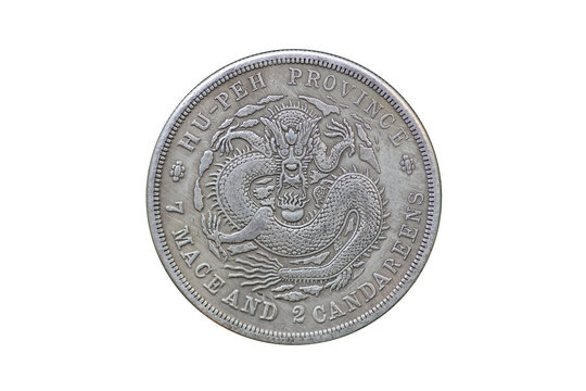 Old Chinese coin with dragon isolated on white background.