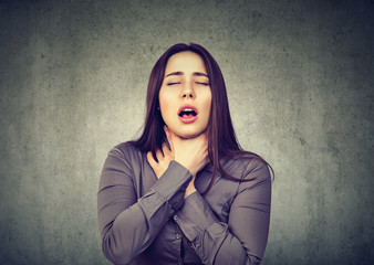 Woman having asthma attack or choking can't breath suffering from respiration problems