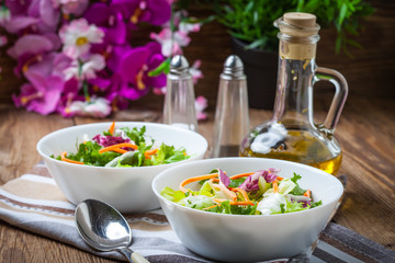 Mixed salad in white bowl.