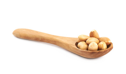 Spoon full of peanuts isolated