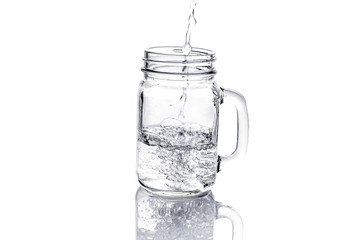 mason jar with water isolated on white