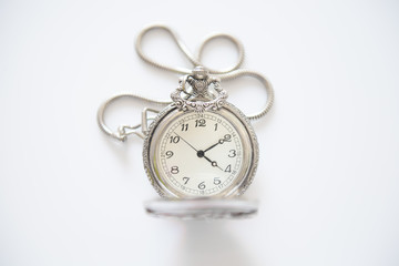 old pocket watch on white background (vintage filter effect)