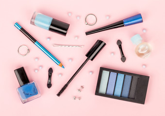 Obraz na płótnie Canvas set of professional decorative cosmetics, makeup tools and accessory on pink background. beauty, fashion and shopping concept. flat lay composition, top view