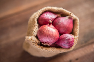 Red onion on a wooden table