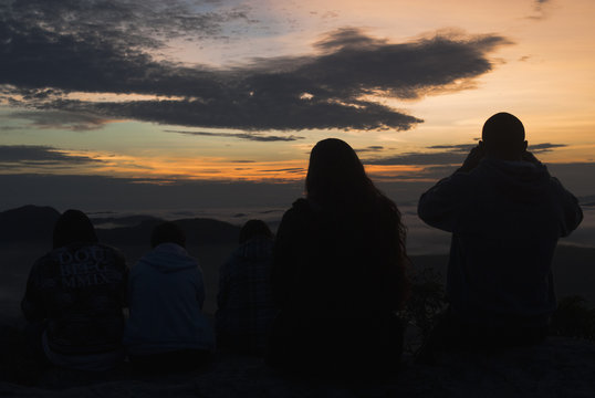 People silhouettes at sunrise in Brazil