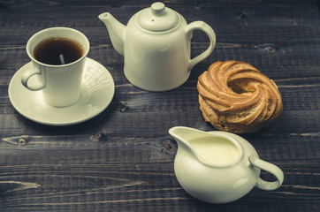 cup of coffee, creamer, teapot and sweets/cup, coffee, creamer, teapot, sweets