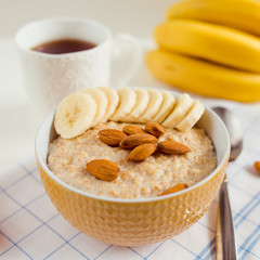 oatmeal with nuts and banana, close-up
