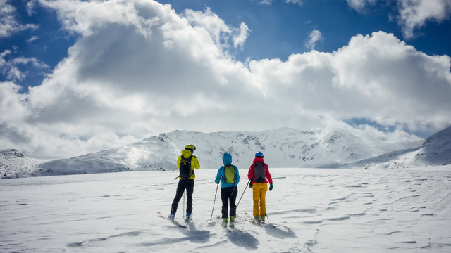 Three skiers admiring the view