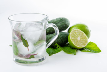 Fresh lemonade. Cucumbers lime ginger and green leaves