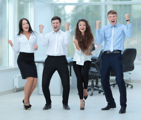 Successful and confident business team celebrating win