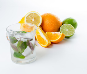 Fresh lemonade. Fruit. Orange lemon lime and green mint
