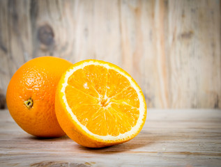 Fruit. Orange on a wooden background