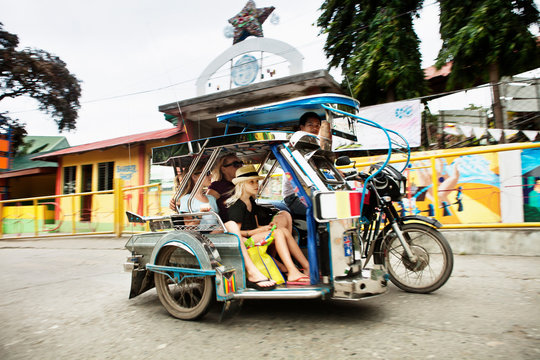 Family riding in alternative transport