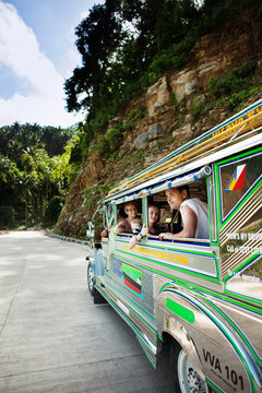 Passengers sitting by bus window