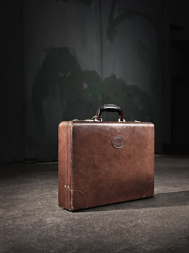 Leather suitcase abandoned on street