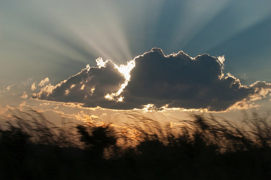 Sun shining through clouds