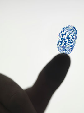 Finger leaving QR code in fingerprint