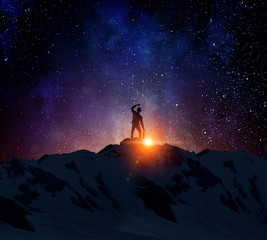 Fototapeta premium Businessman against starry sky . Mixed media . Mixed media