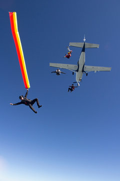 People skydiving from plane