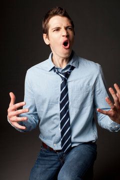 Man grimacing indoors