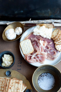Meat, cheese, crackers and garlic