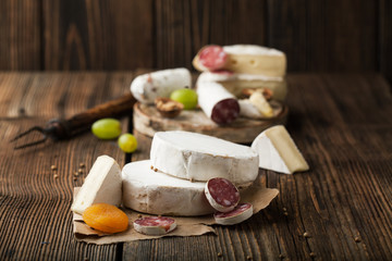 Assorted cheese and salami with honey