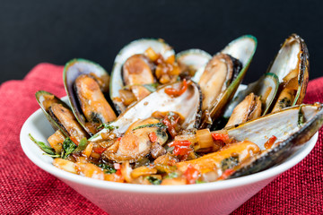 Mussel with white wine sauce on table