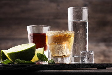 Selection of alcoholic drinks on rustic stone plate