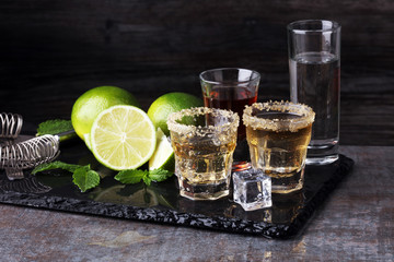 Selection of alcoholic drinks on rustic stone plate