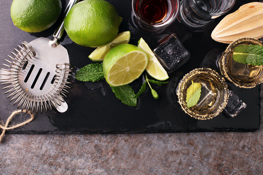 Selection of alcoholic drinks on rustic stone plate