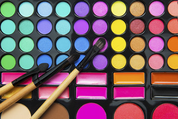 Cosmetics brushes and eyeshadow palette
