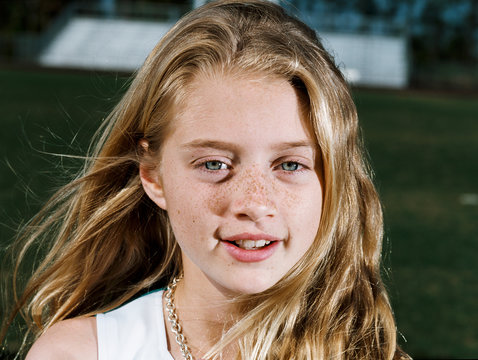 Girl smiling outdoors, portrait