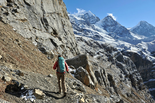 Female trekker following trail, Thorung La, Nepal