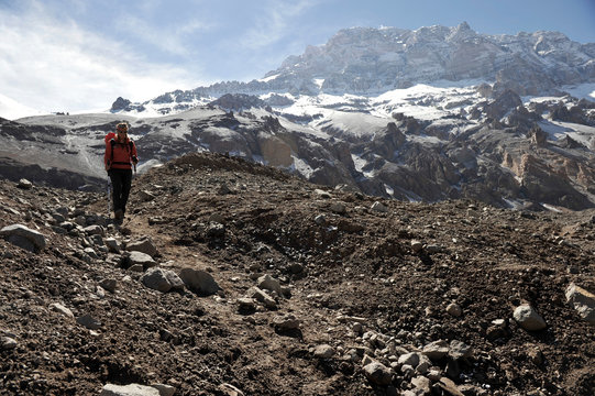 Woman descends the Horcones Valley from Plaza de Mulas on Aconcagua in the Andes Mountains, Mendoza Province, Argentina