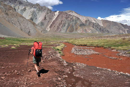 Woman descends the Horcones Valley from Plaza de Mulas on Aconcagua in the Andes Mountains, Mendoza Province, Argentina