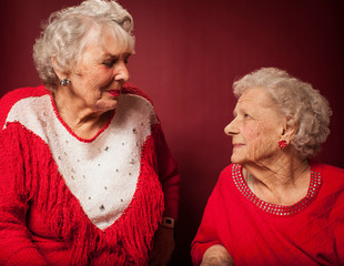 Two senior women looking at each other