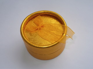 Golden gift box with ribbon bow